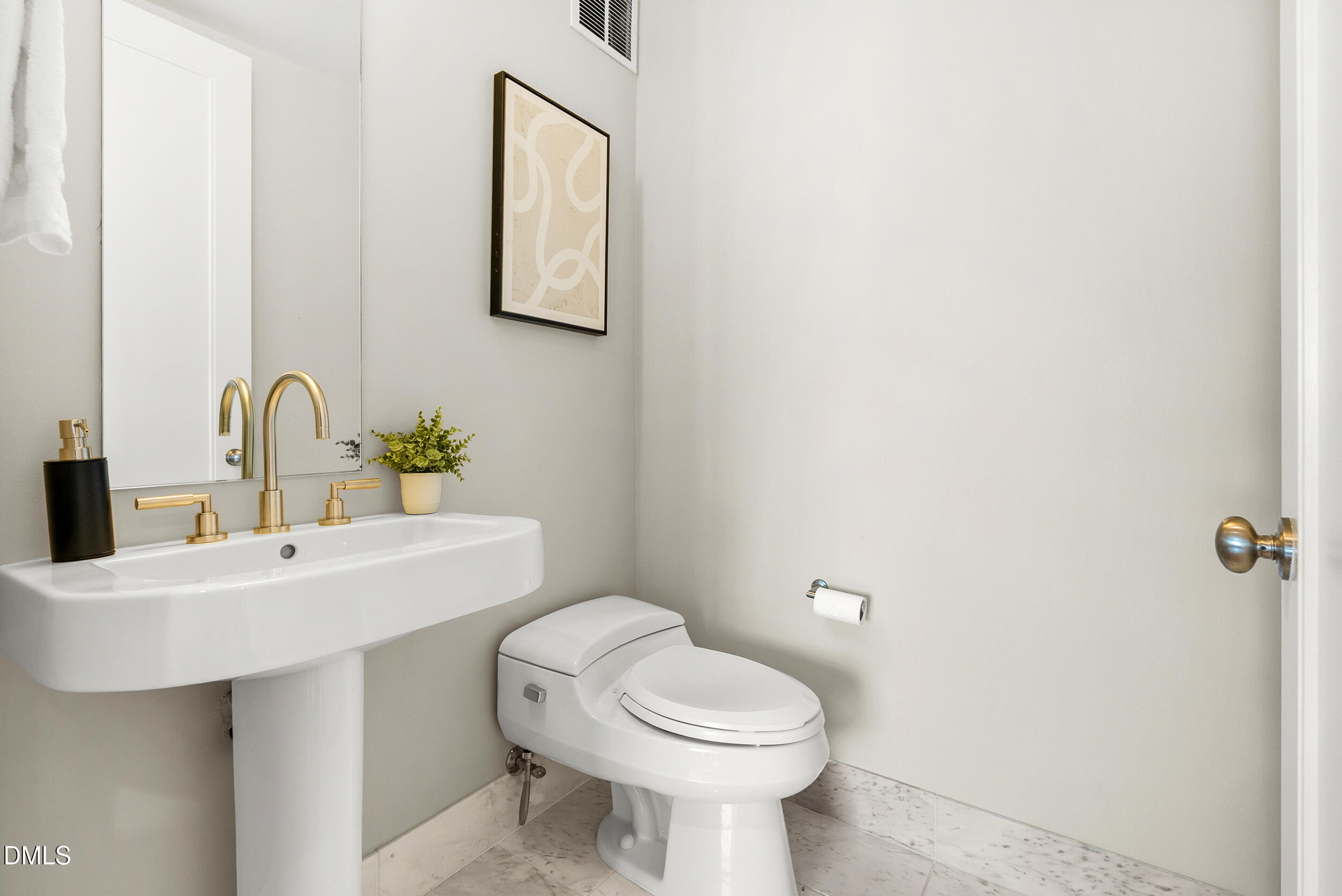 122 North Harrington Street Raleigh, NC 27603 - Photo 28 of 46 a bathroom with a toilet sink and mirror