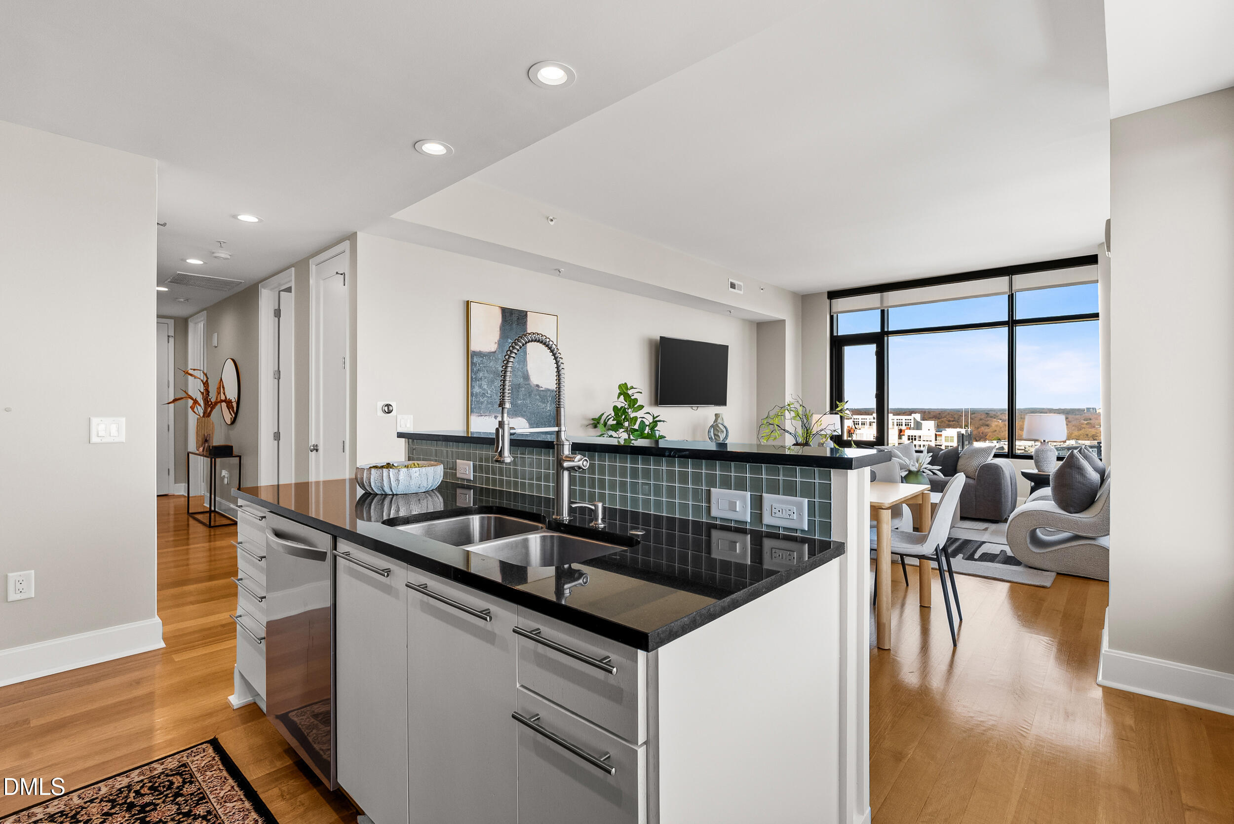122 North Harrington Street Raleigh, NC 27603 - Photo 9 of 46 a kitchen with granite countertop a sink and a stove top oven