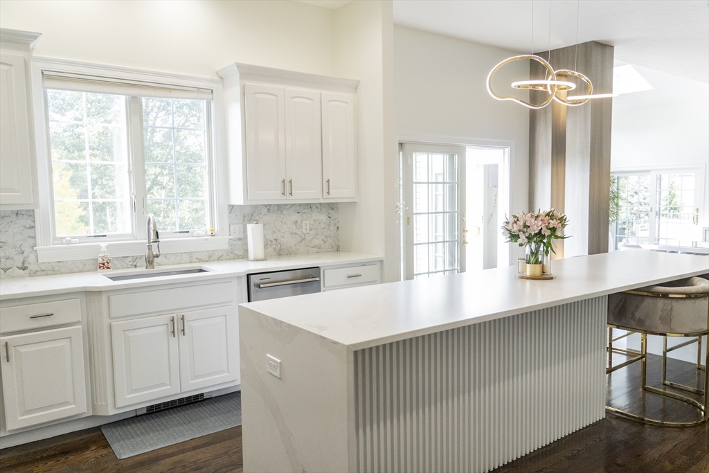 25 Collins Road Berlin, MA 01503 - Photo 15 of 38 a kitchen with a sink a window and cabinets