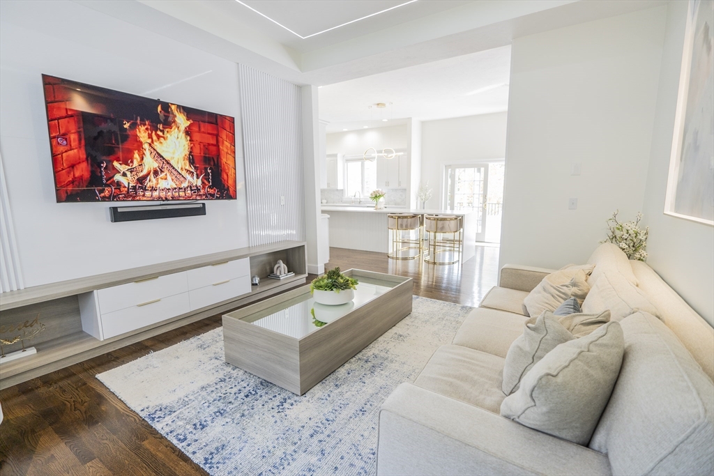 25 Collins Road Berlin, MA 01503 - Photo 22 of 38 a living room with furniture and a flat screen tv