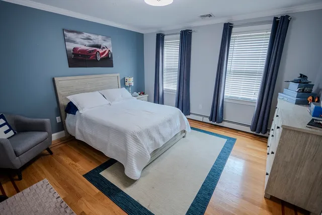 a bedroom with a bed and a couch