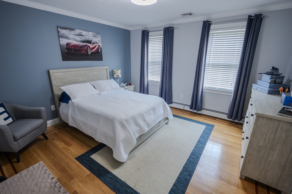 25 Collins Road Berlin, MA 01503 - Photo 27 of 38 a bedroom with a bed and a couch