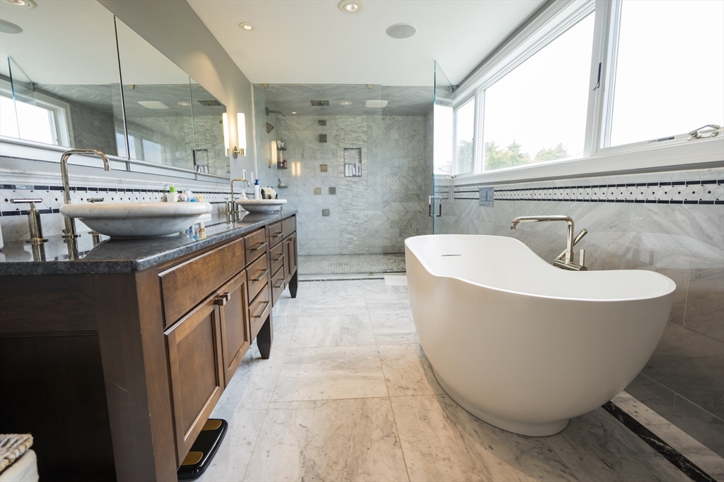 25 Collins Road Berlin, MA 01503 - Photo 32 of 38 a bathroom with a bathtub and double sink