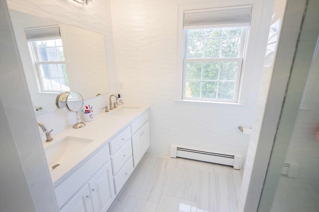 25 Collins Road Berlin, MA 01503 - Photo 33 of 38 a bathroom with a sink a window and a mirror
