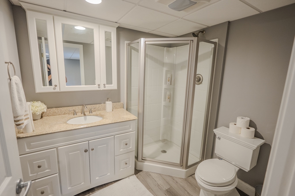 25 Collins Road Berlin, MA 01503 - Photo 37 of 38 a bathroom with a granite countertop sink toilet and shower