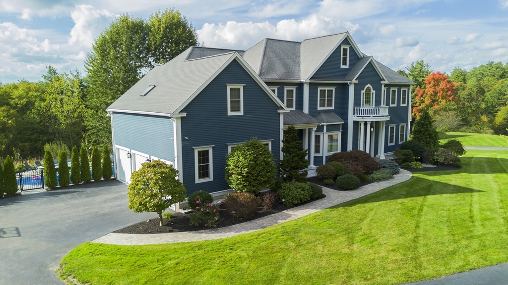 25 Collins Road Berlin, MA 01503 - Photo 4 of 38 a front view of a house with a yard