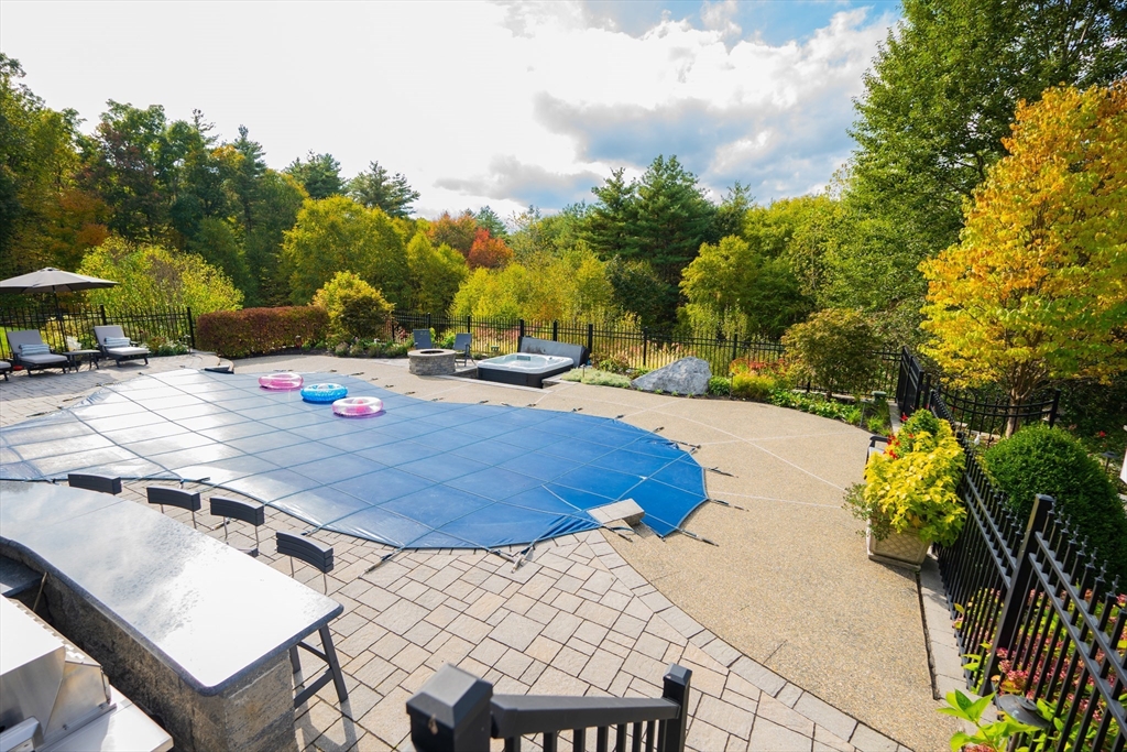 25 Collins Road Berlin, MA 01503 - Photo 10 of 38 a view of a swimming pool with a patio