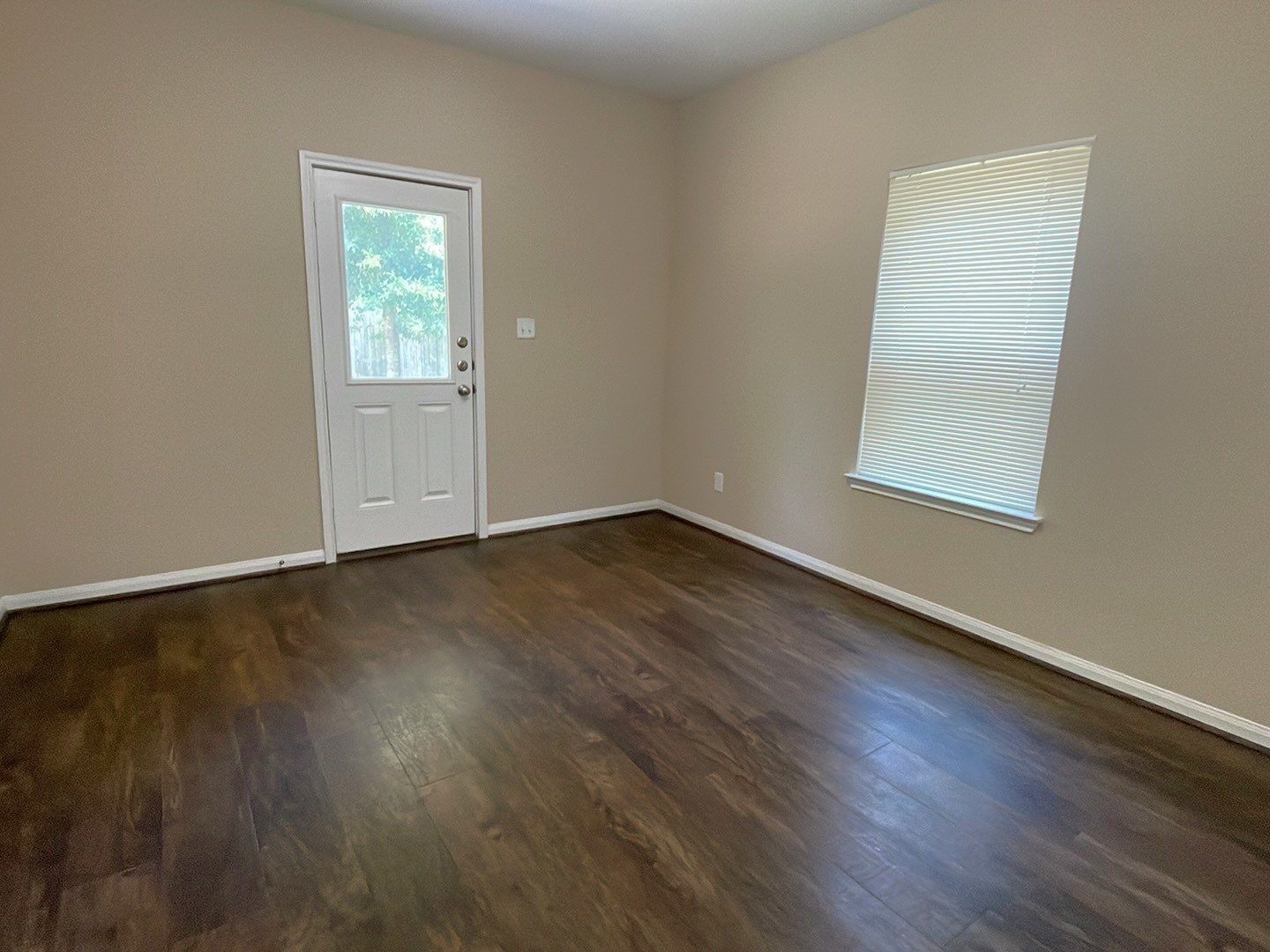 8138 Gallahad Street, Unit A Houston, TX 77078 - Photo 13 of 26 an empty room with wooden floor and windows