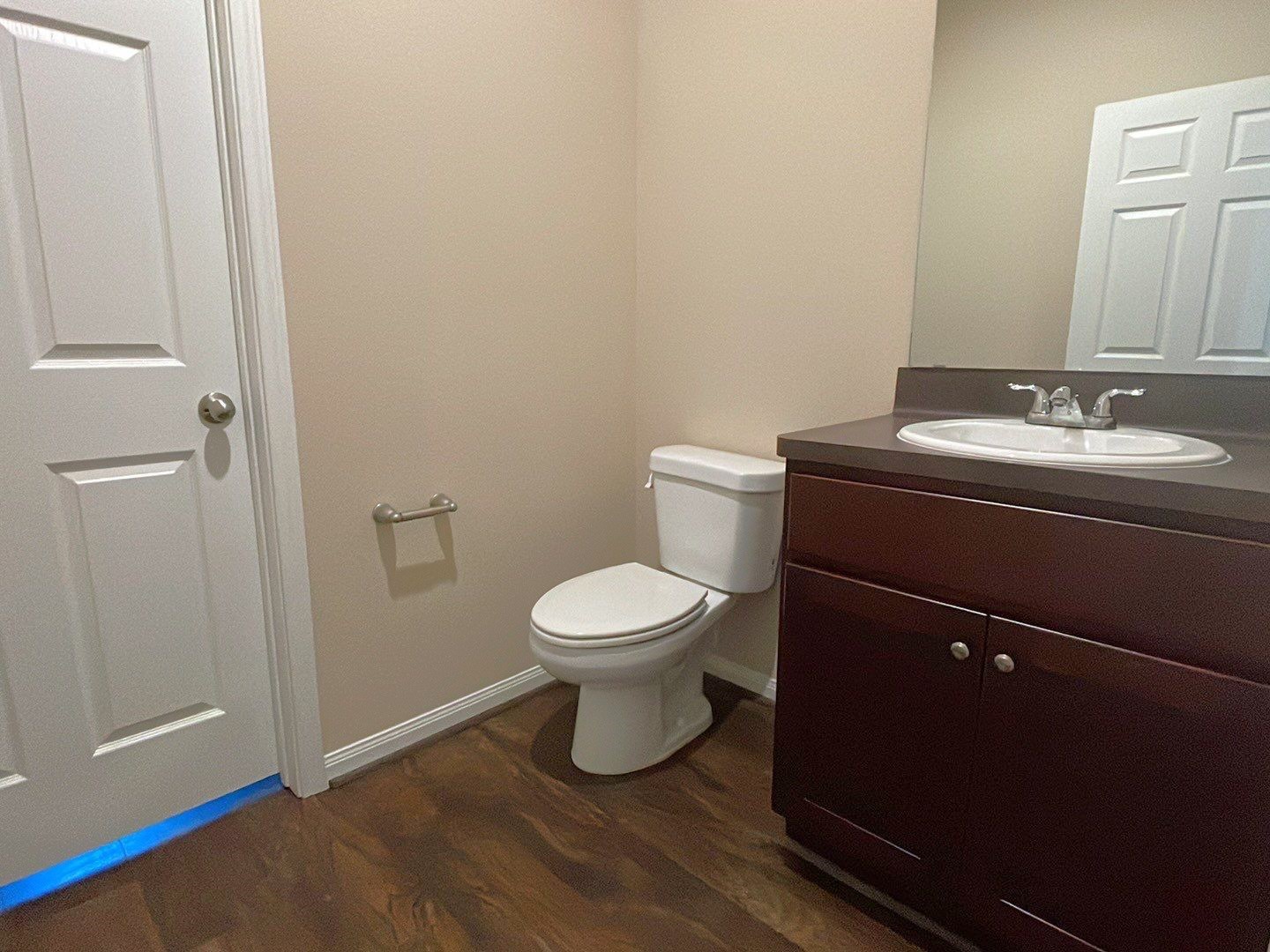 8138 Gallahad Street, Unit A Houston, TX 77078 - Photo 16 of 26 a bathroom with a toilet a sink and mirror