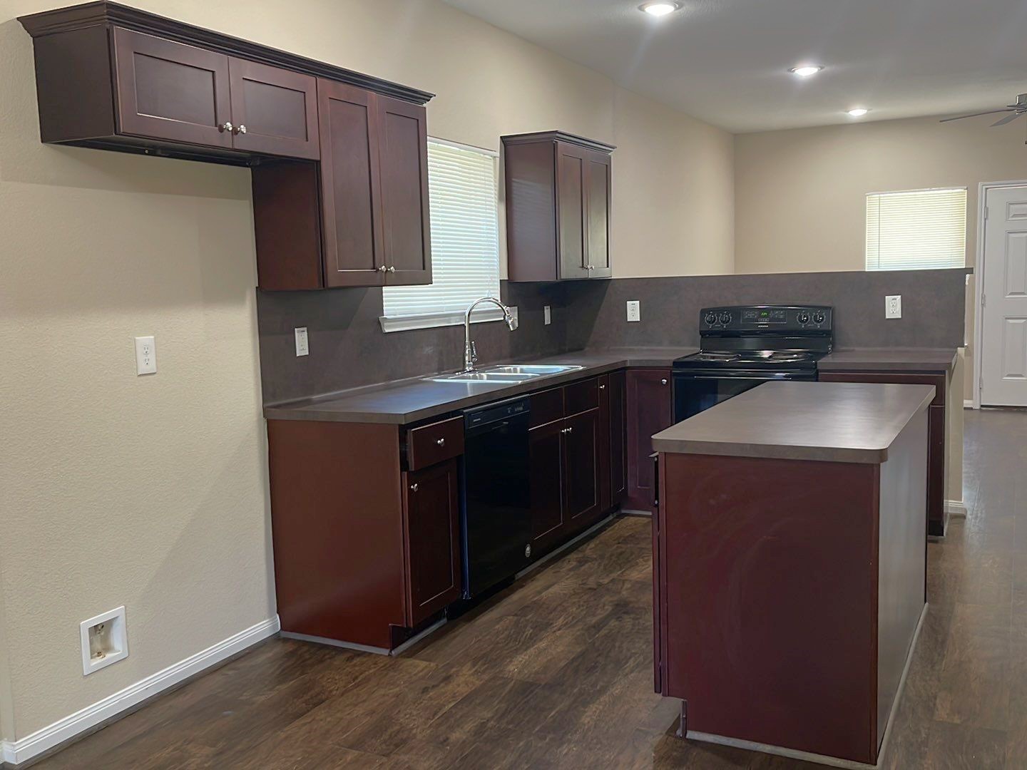 8138 Gallahad Street, Unit A Houston, TX 77078 - Photo 4 of 26 a kitchen with stainless steel appliances granite countertop a sink stove and microwave