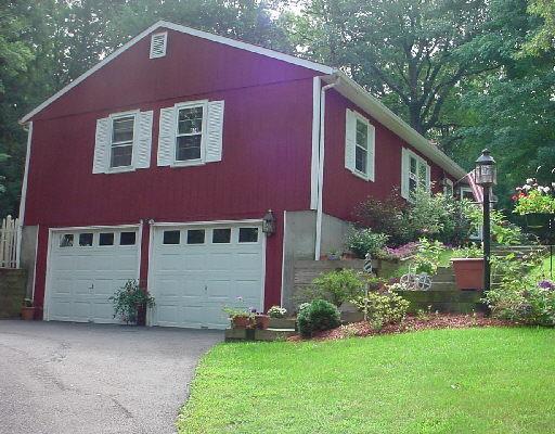 42 Philo Curtis Road Newtown, CT 06482 - Photo 1 of 1 a front view of a house with a yard
