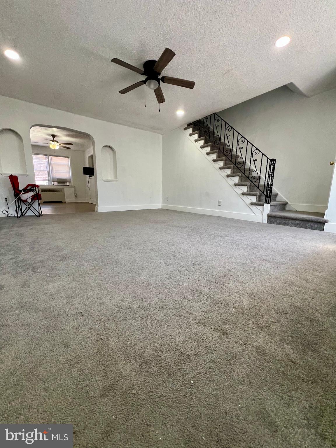 624 Briarcliff Road, Unit MAIN Upper Darby, PA 19082 - Photo 4 of 20 a view of a livingroom with a staircase