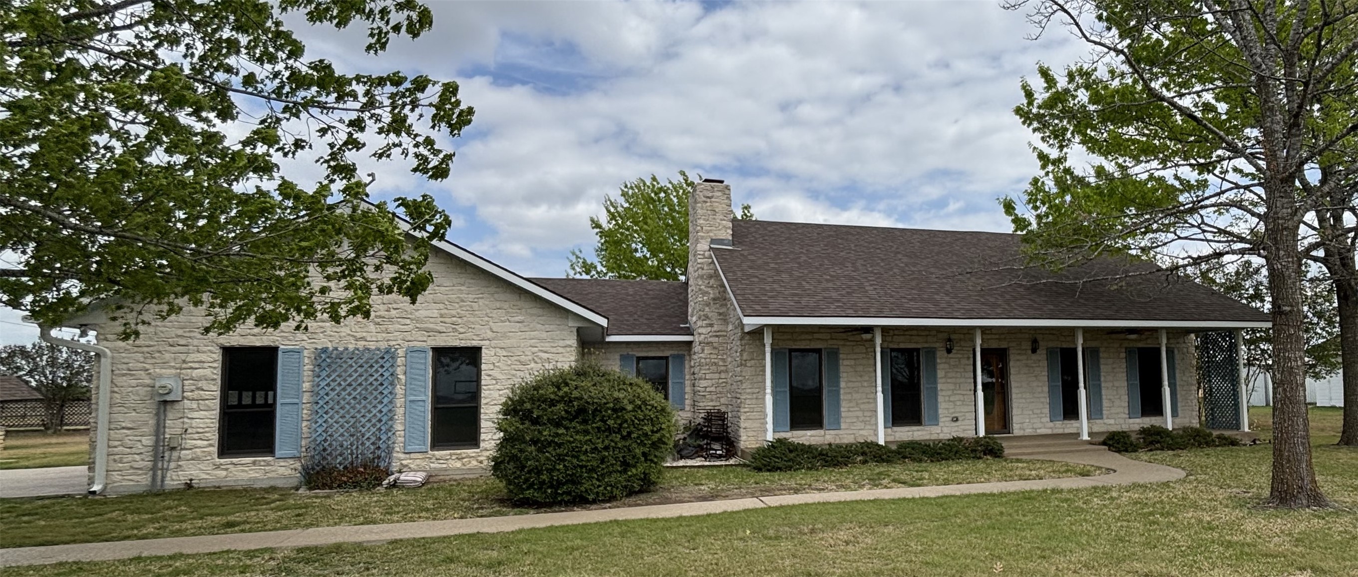 front view of a house with a yard