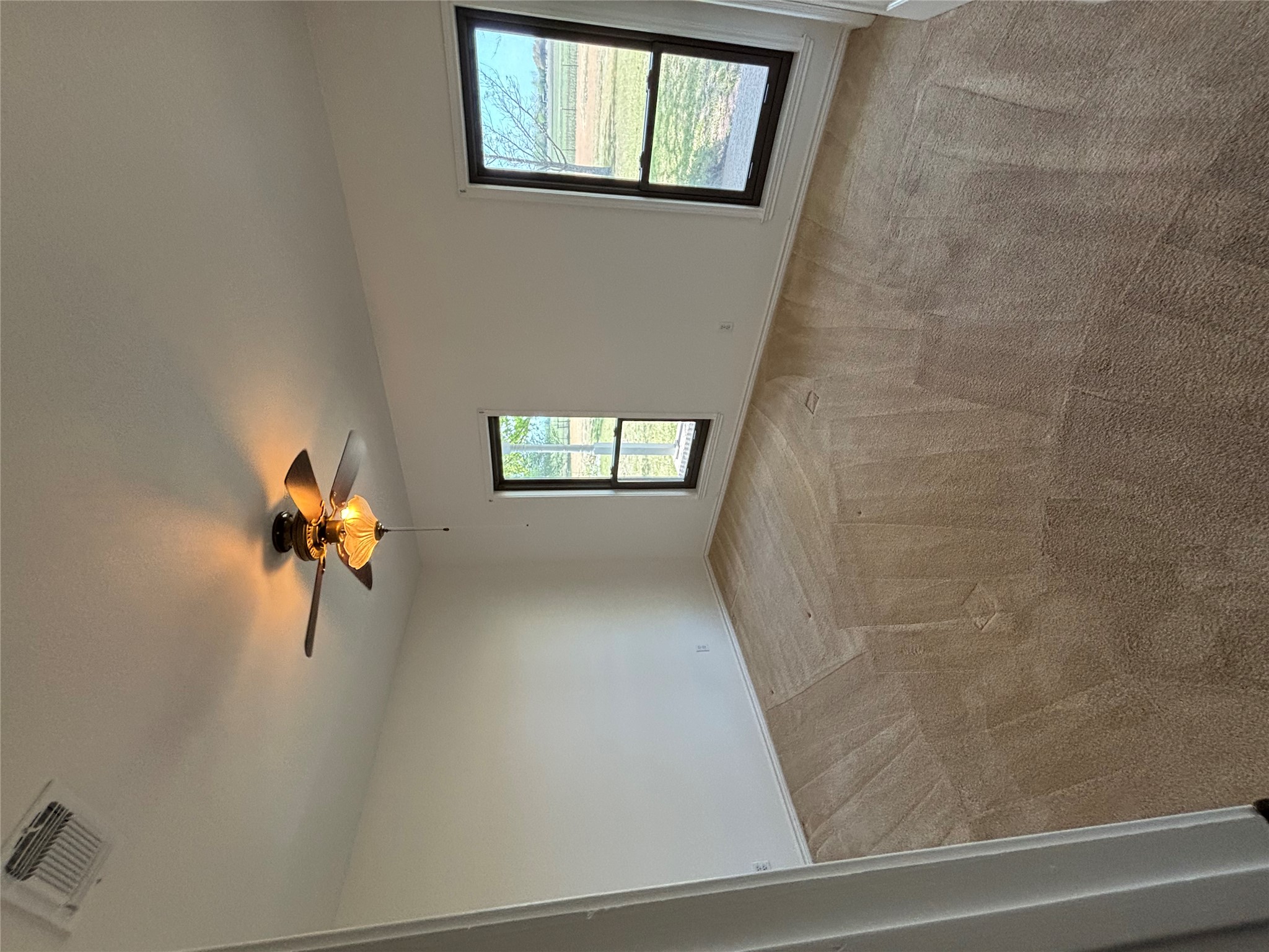 140 County Road 167 Georgetown, TX 78626 - Photo 11 of 21 an empty room with windows and chandelier fan