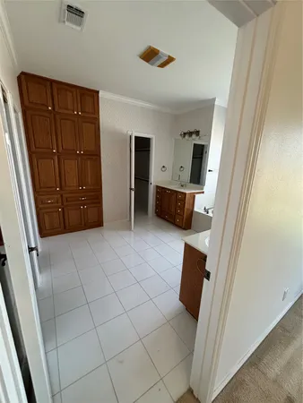 a spacious bathroom with a window and tub