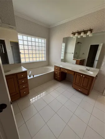 a bathroom with a glass door shower and toilet