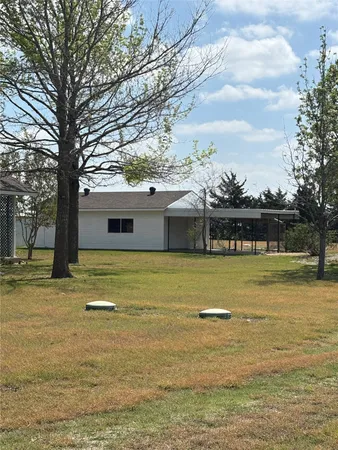 a front view of a house with swimming pool