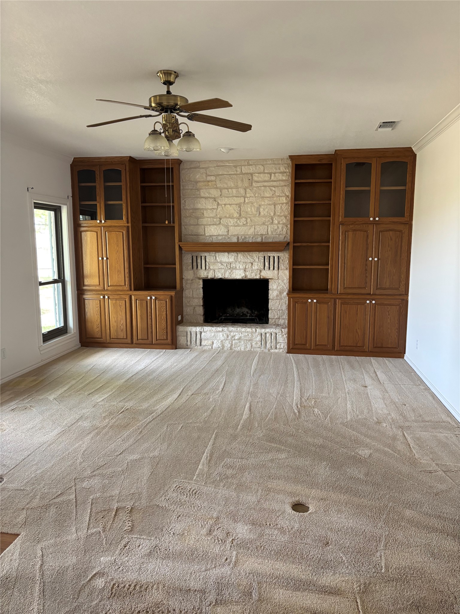 140 County Road 167 Georgetown, TX 78626 - Photo 7 of 21 a view of a livingroom with a fireplace cabinet and a window