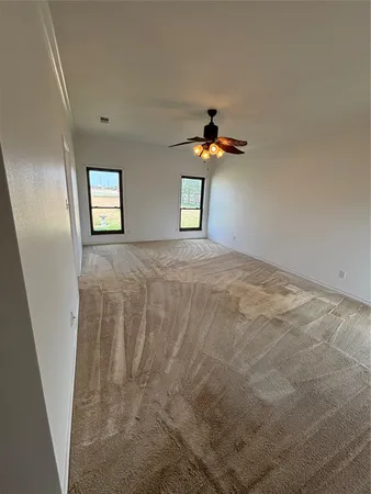 a view of empty room with windows