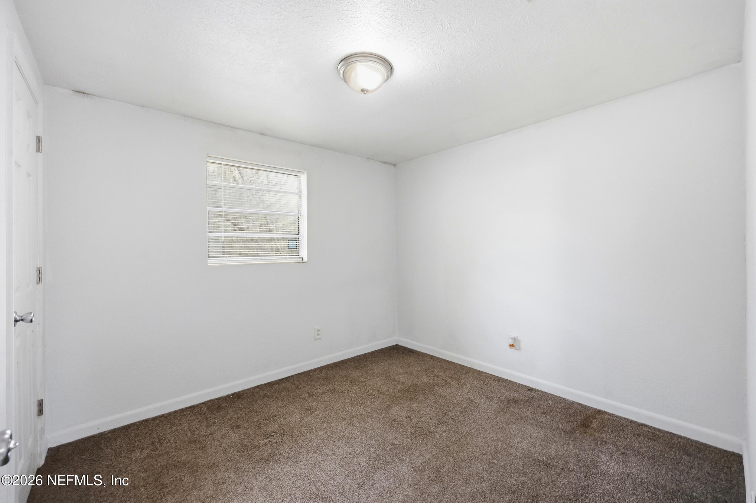 9843 Wagner Road Jacksonville, FL 32219 - Photo 12 of 40 an empty room with windows