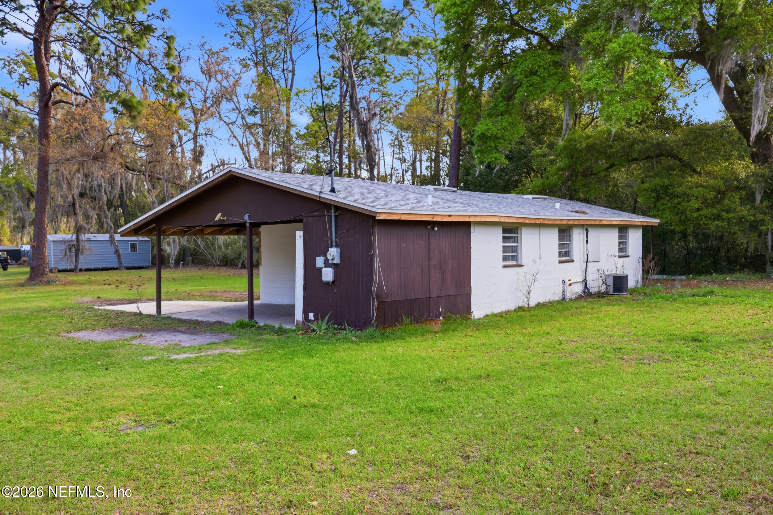 9843 Wagner Road Jacksonville, FL 32219 - Photo 16 of 40 a view of a house with a yard