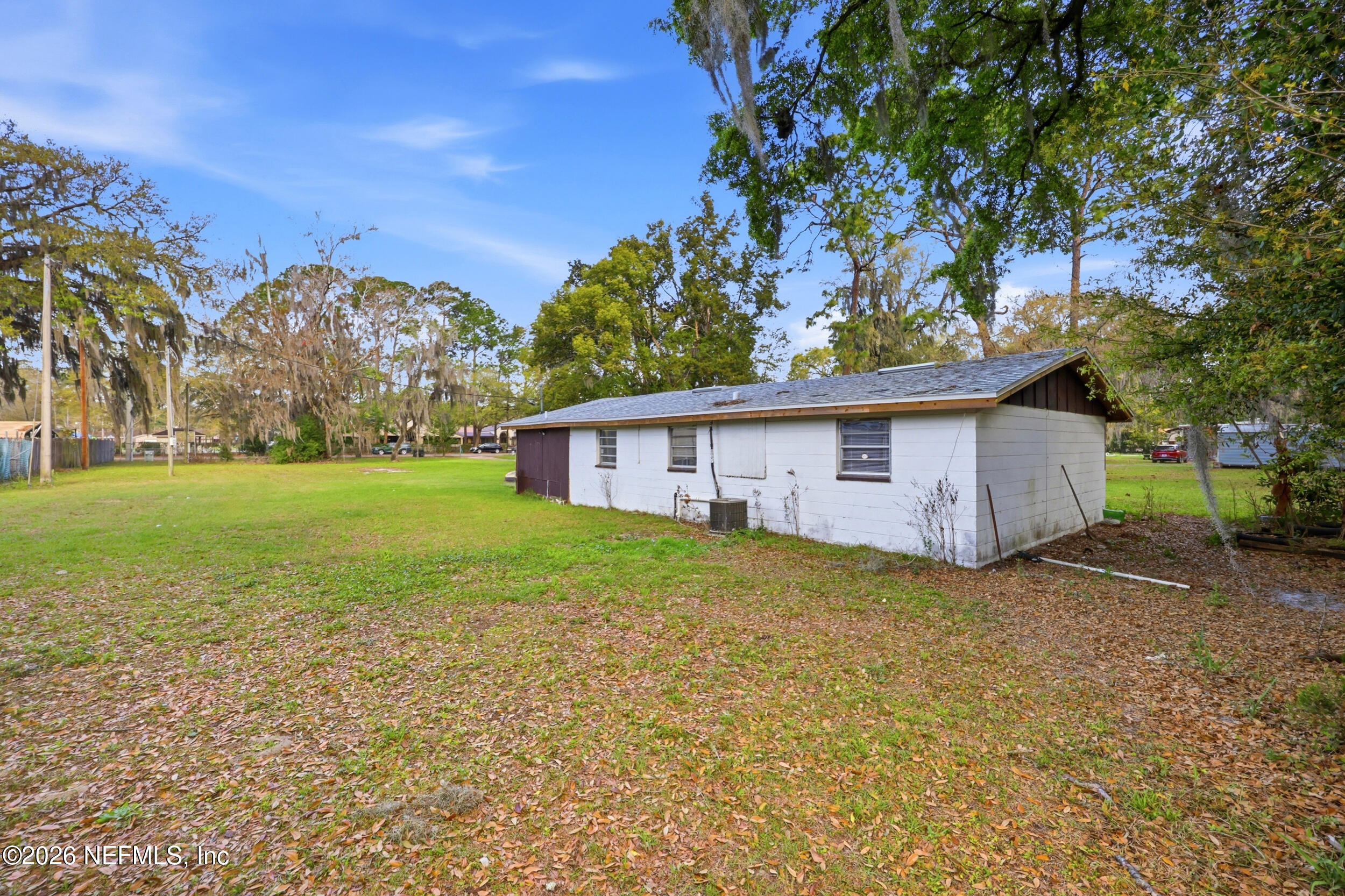 9843 Wagner Road Jacksonville, FL 32219 - Photo 17 of 40 a view of a yard in front of a house with large tree