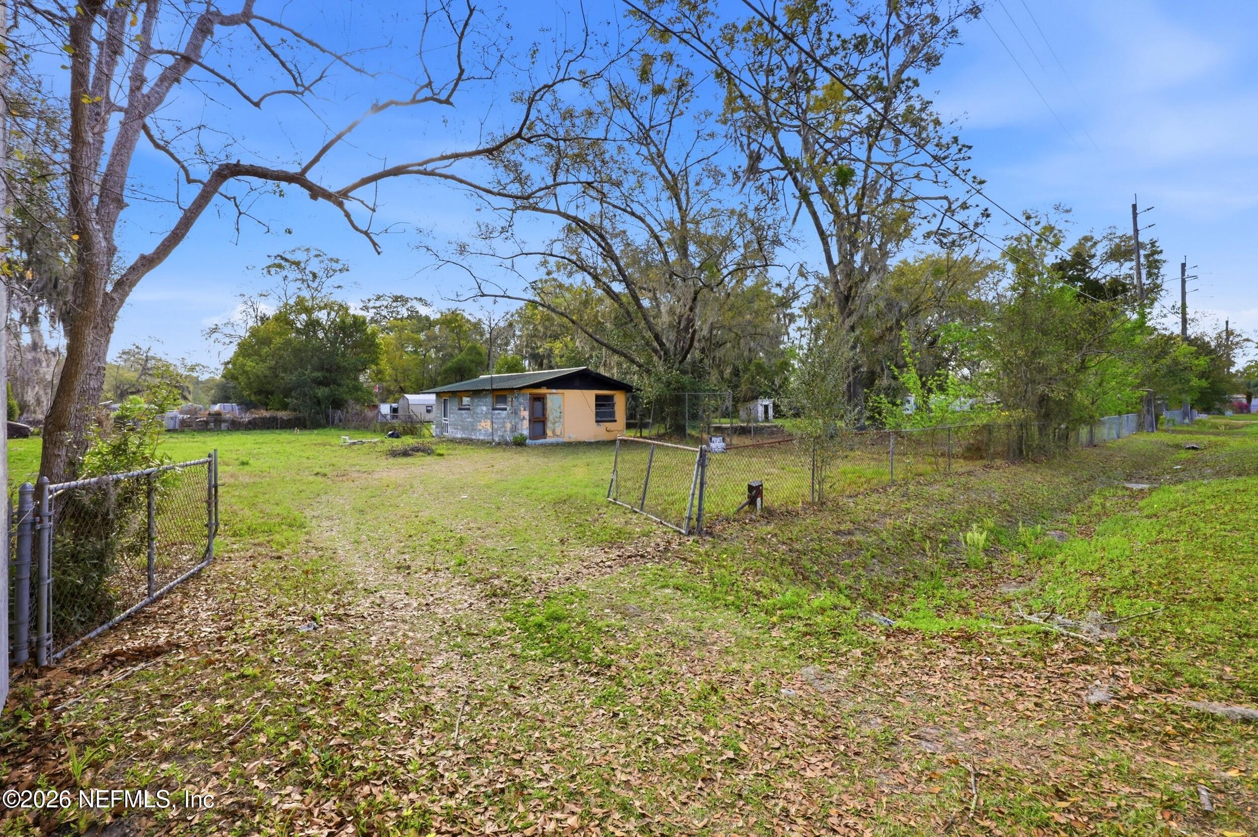 9843 Wagner Road Jacksonville, FL 32219 - Photo 18 of 40 a view of a house with a yard