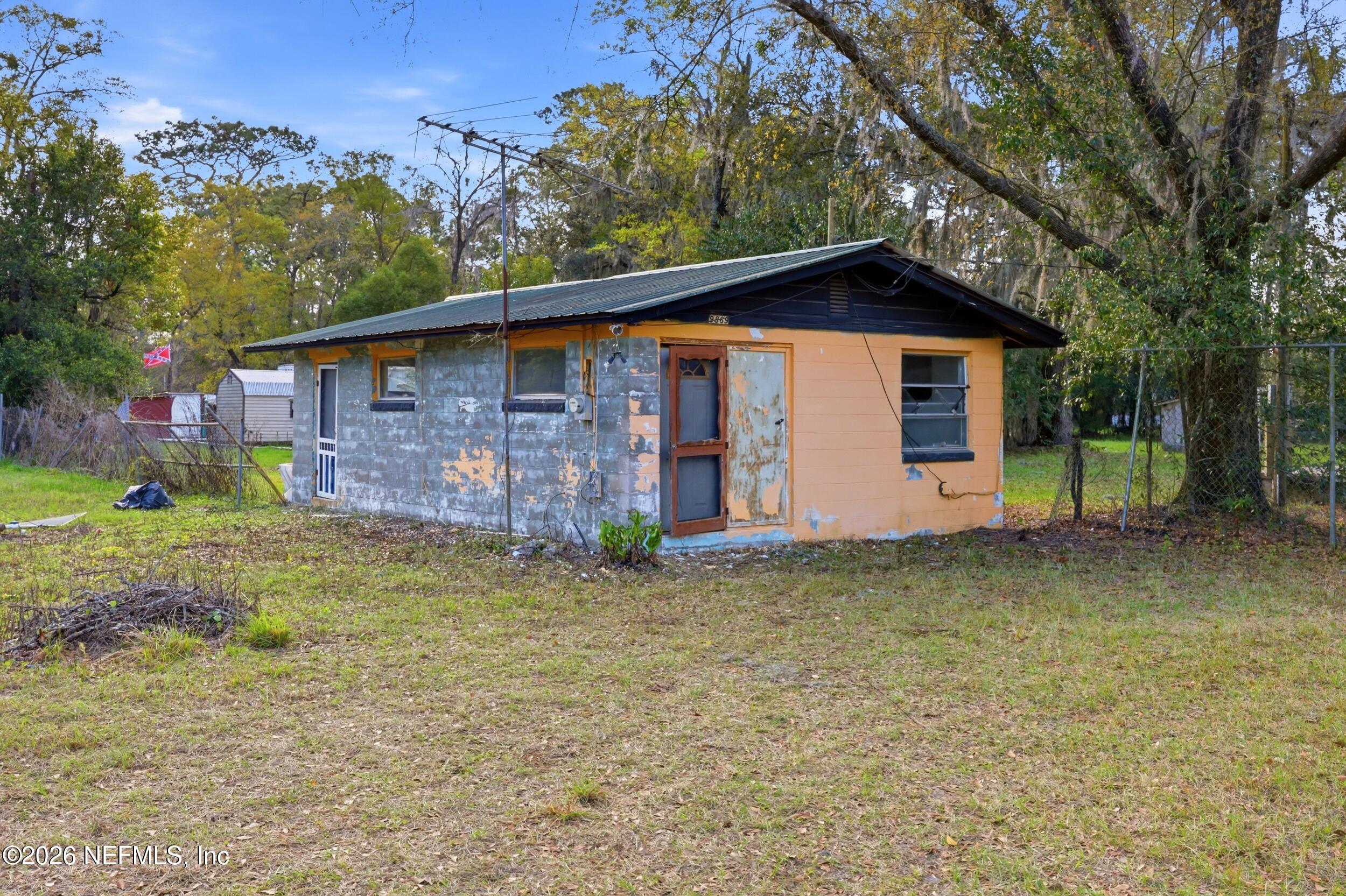 9843 Wagner Road Jacksonville, FL 32219 - Photo 19 of 40 a front view of a house with garden