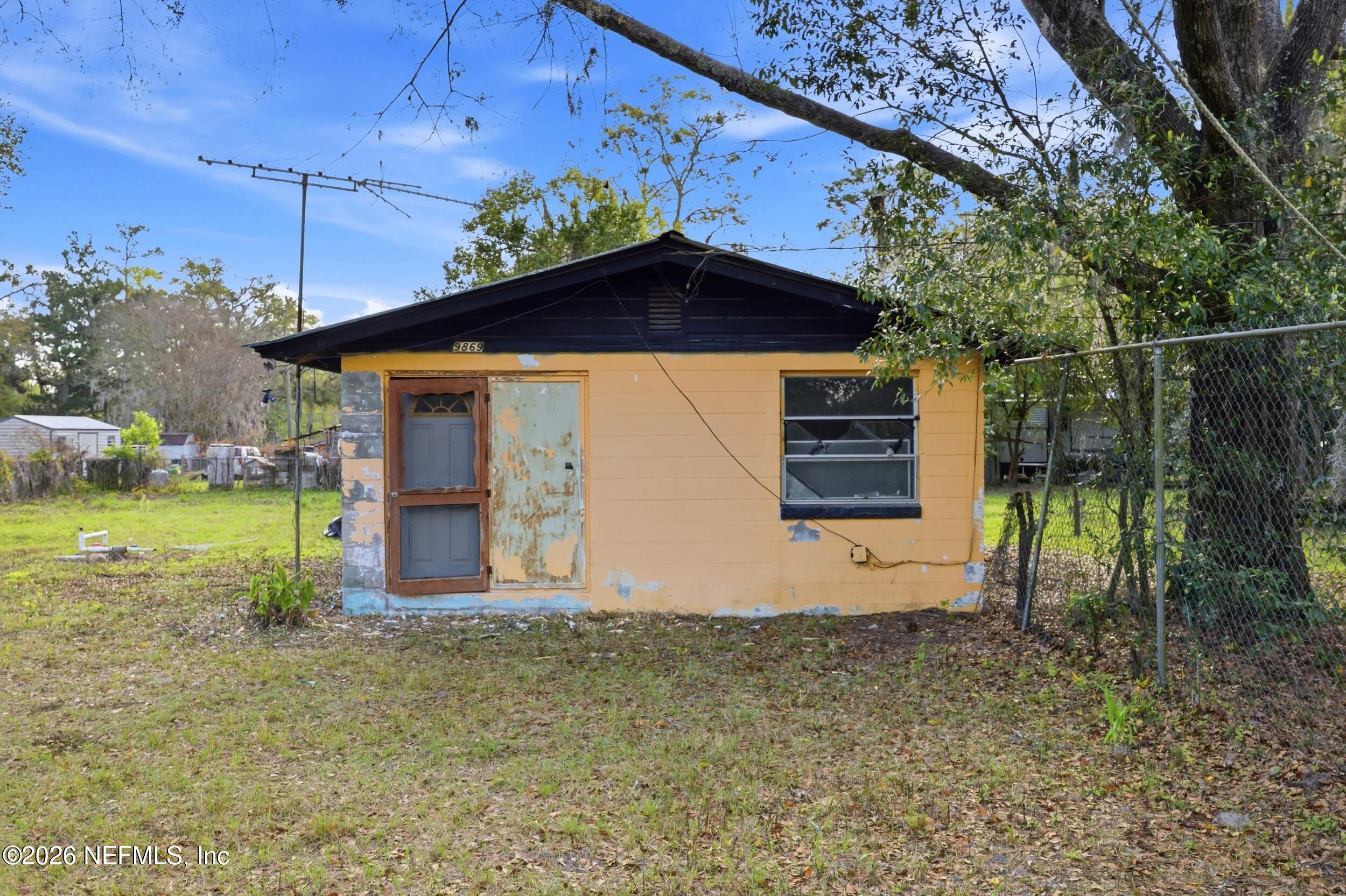 9843 Wagner Road Jacksonville, FL 32219 - Photo 20 of 40 a front view of a house with a yard