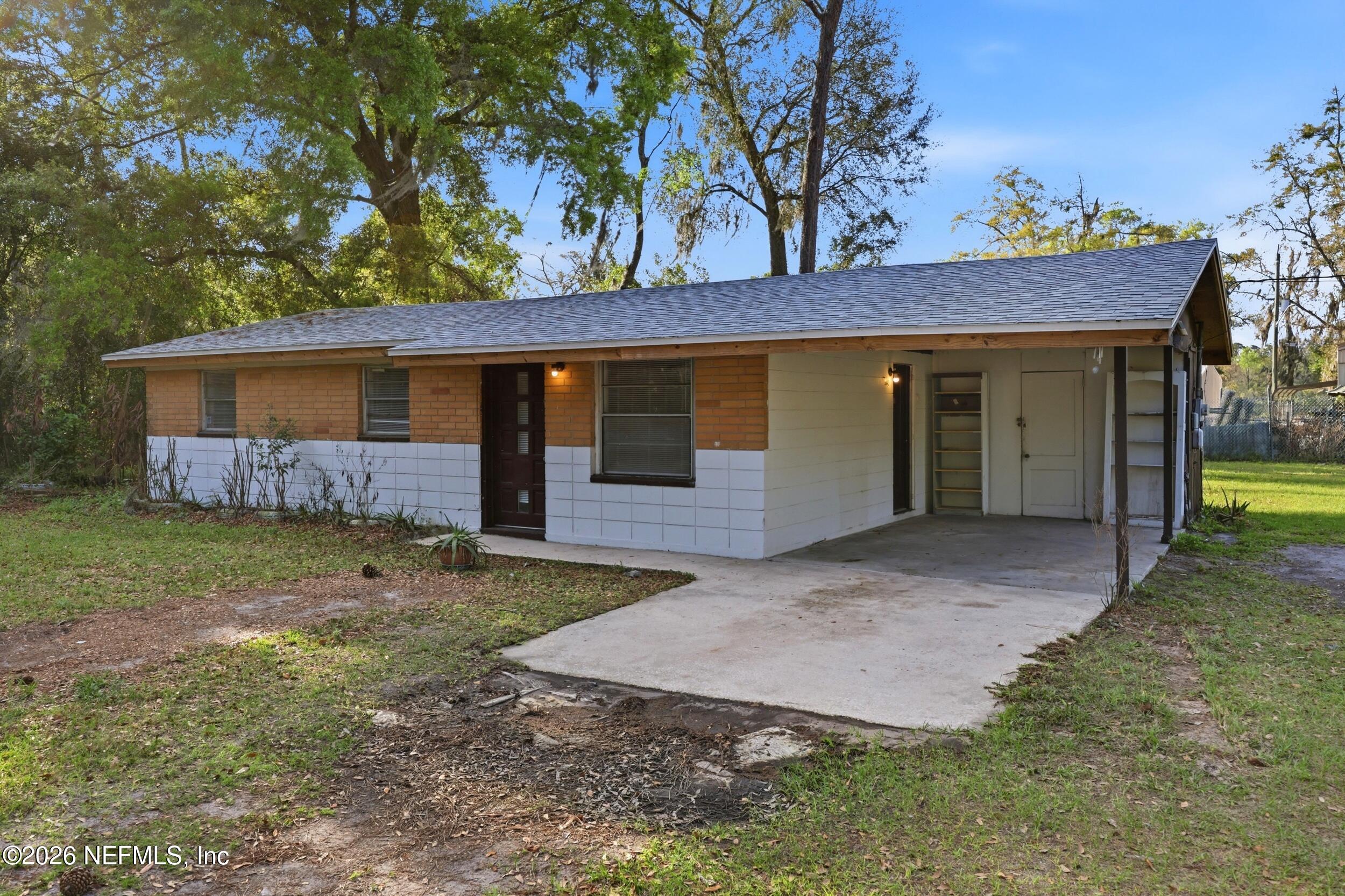 9843 Wagner Road Jacksonville, FL 32219 - Photo 2 of 40 a view of a house with a yard