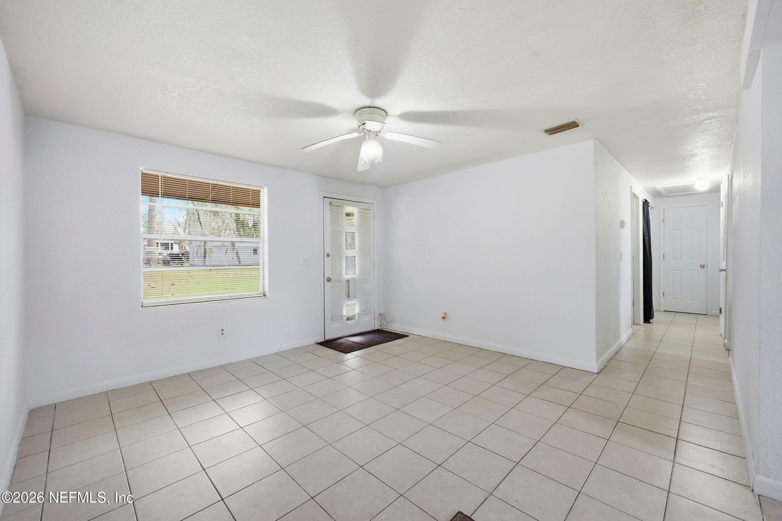 9843 Wagner Road Jacksonville, FL 32219 - Photo 3 of 40 a view of an empty room and window