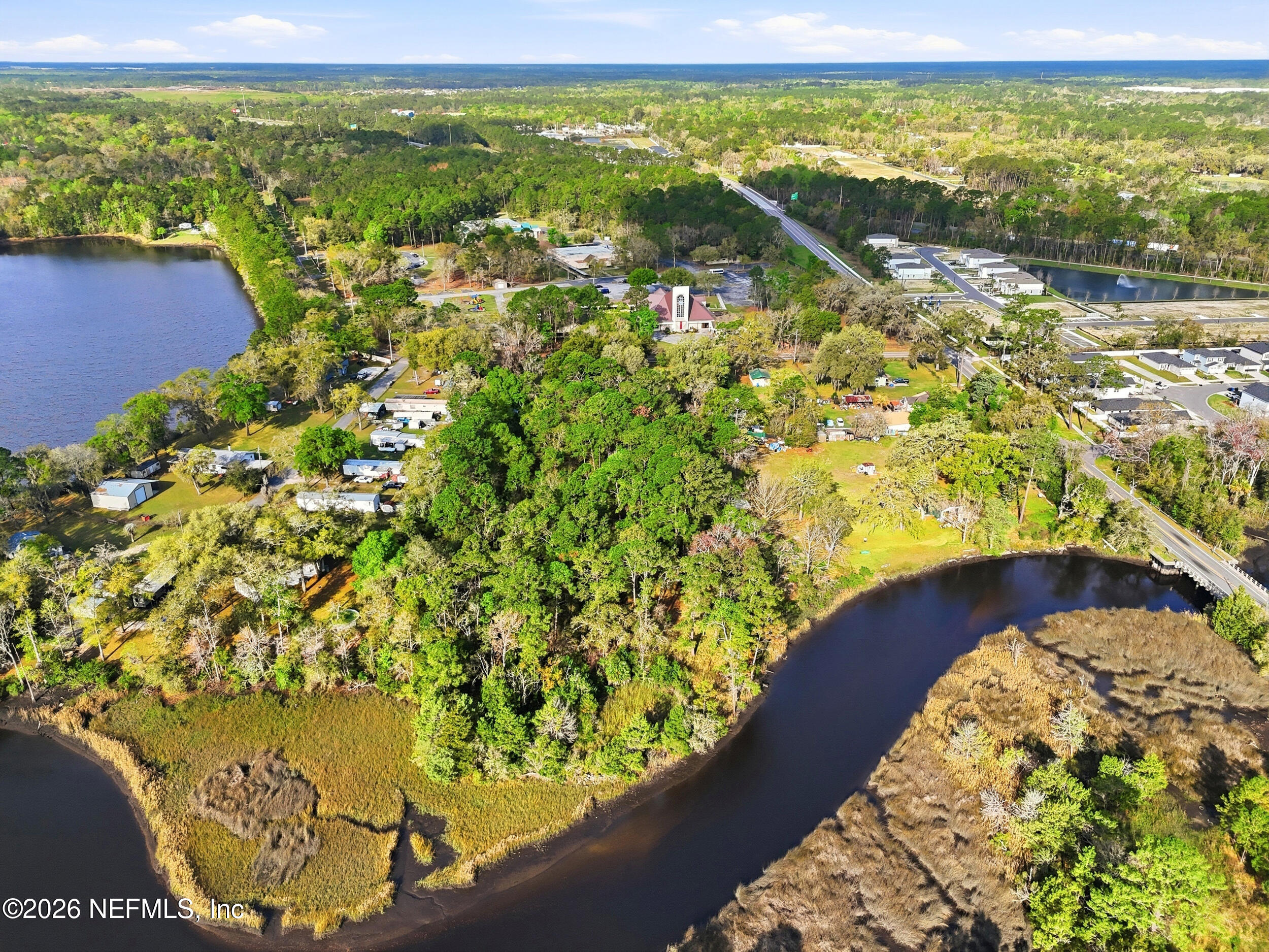 9843 Wagner Road Jacksonville, FL 32219 - Photo 33 of 40 a view of a lake with a building in the background