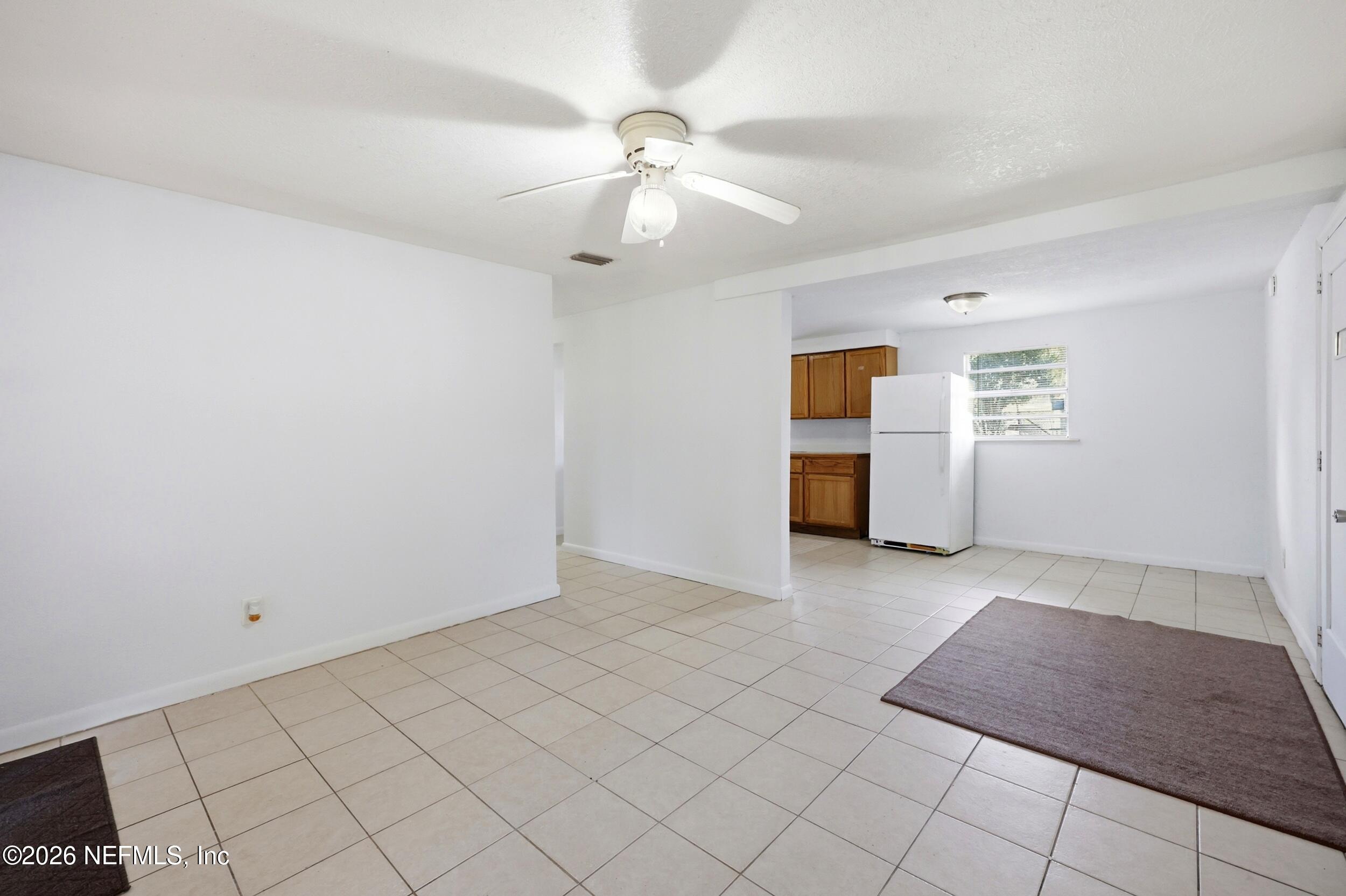 9843 Wagner Road Jacksonville, FL 32219 - Photo 4 of 40 an empty room with fan and windows