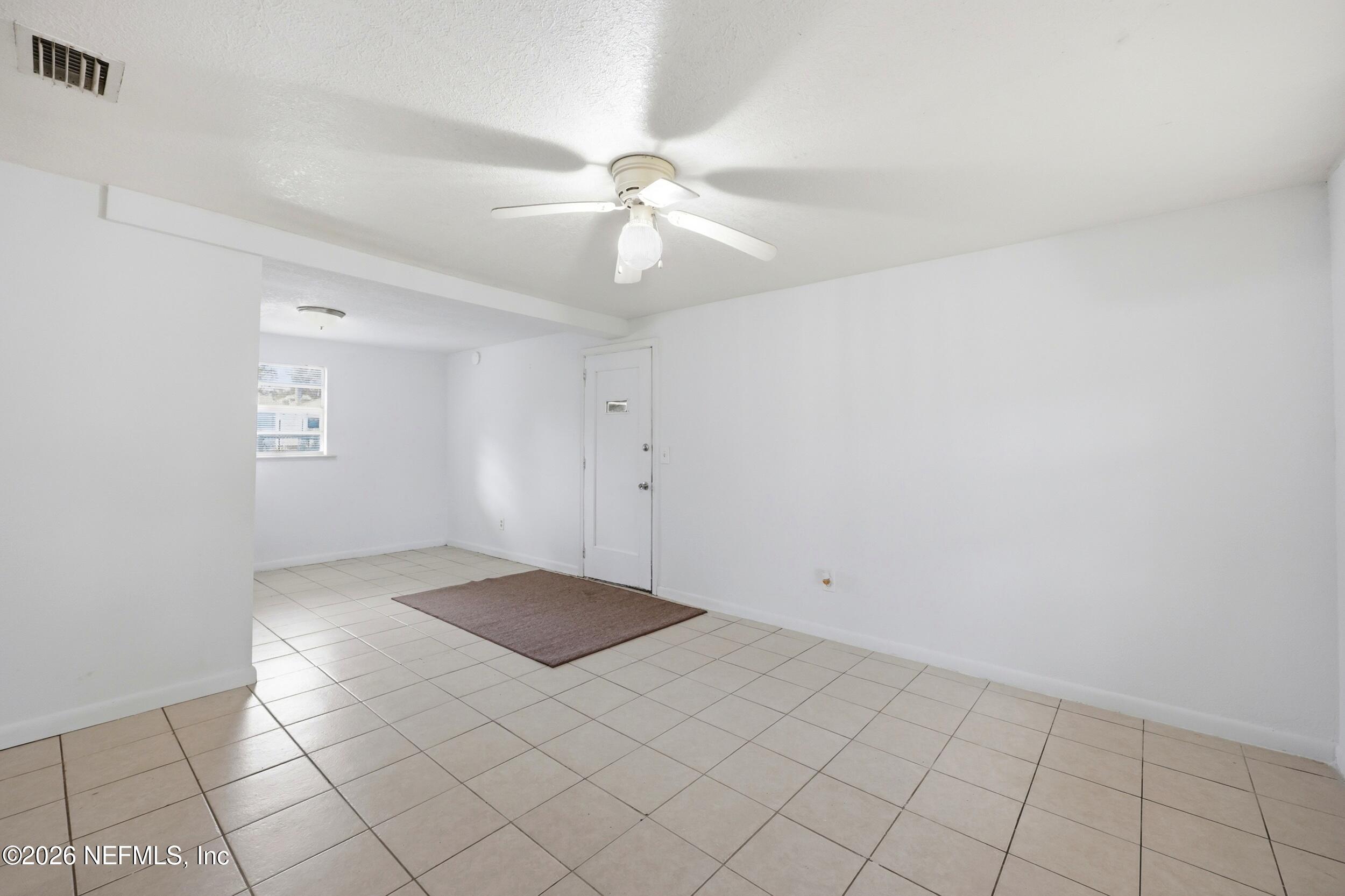 9843 Wagner Road Jacksonville, FL 32219 - Photo 5 of 40 a view of an empty room and window