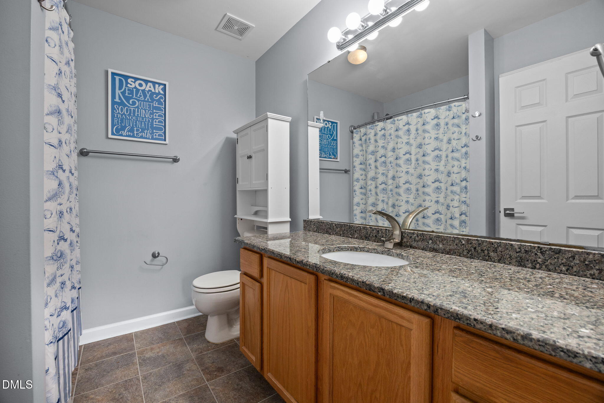 4522 Centrebrook Circle Raleigh, NC 27616 - Photo 12 of 24 a bathroom with a granite countertop sink toilet and shower