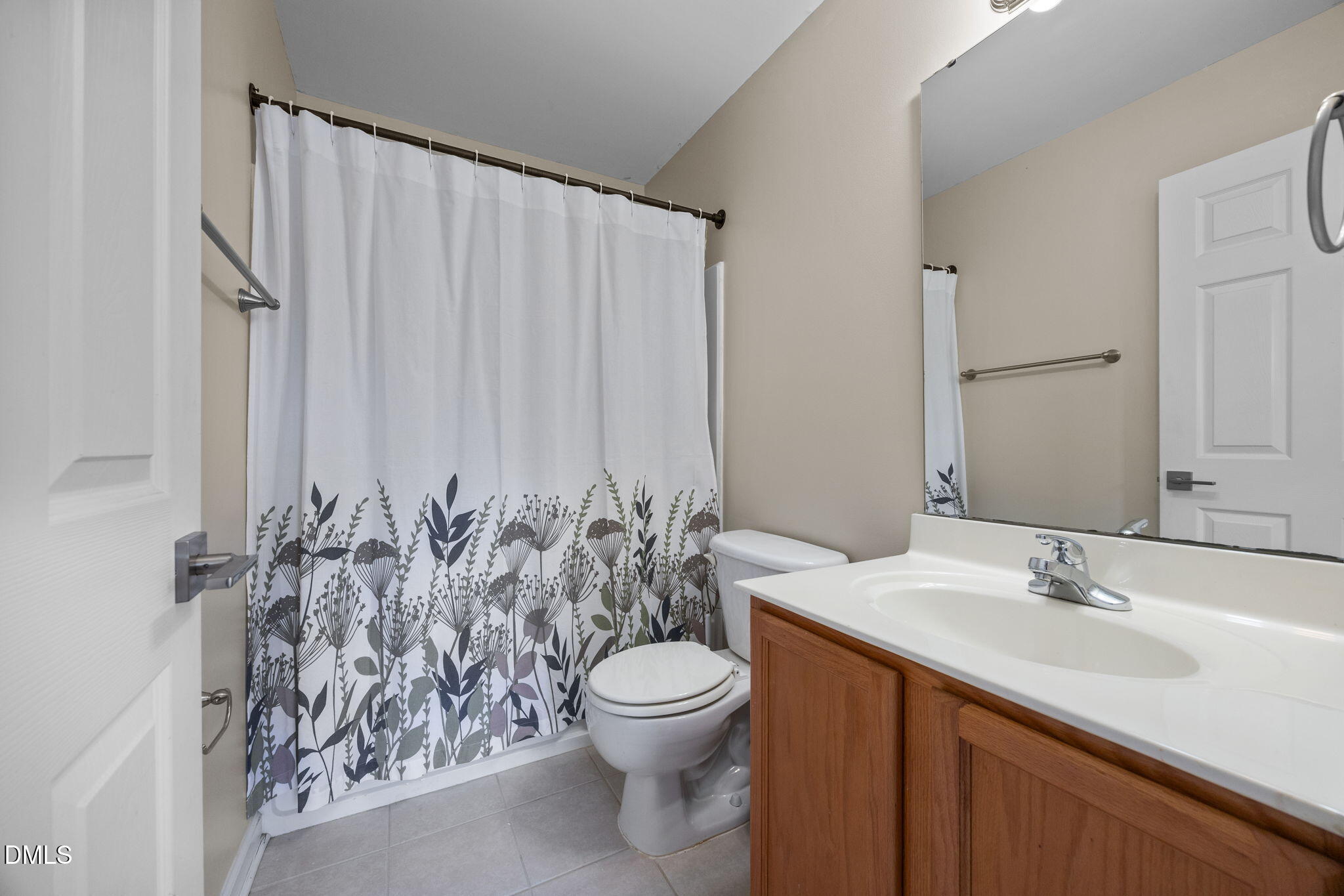 4522 Centrebrook Circle Raleigh, NC 27616 - Photo 15 of 24 a bathroom with a toilet a sink and a mirror
