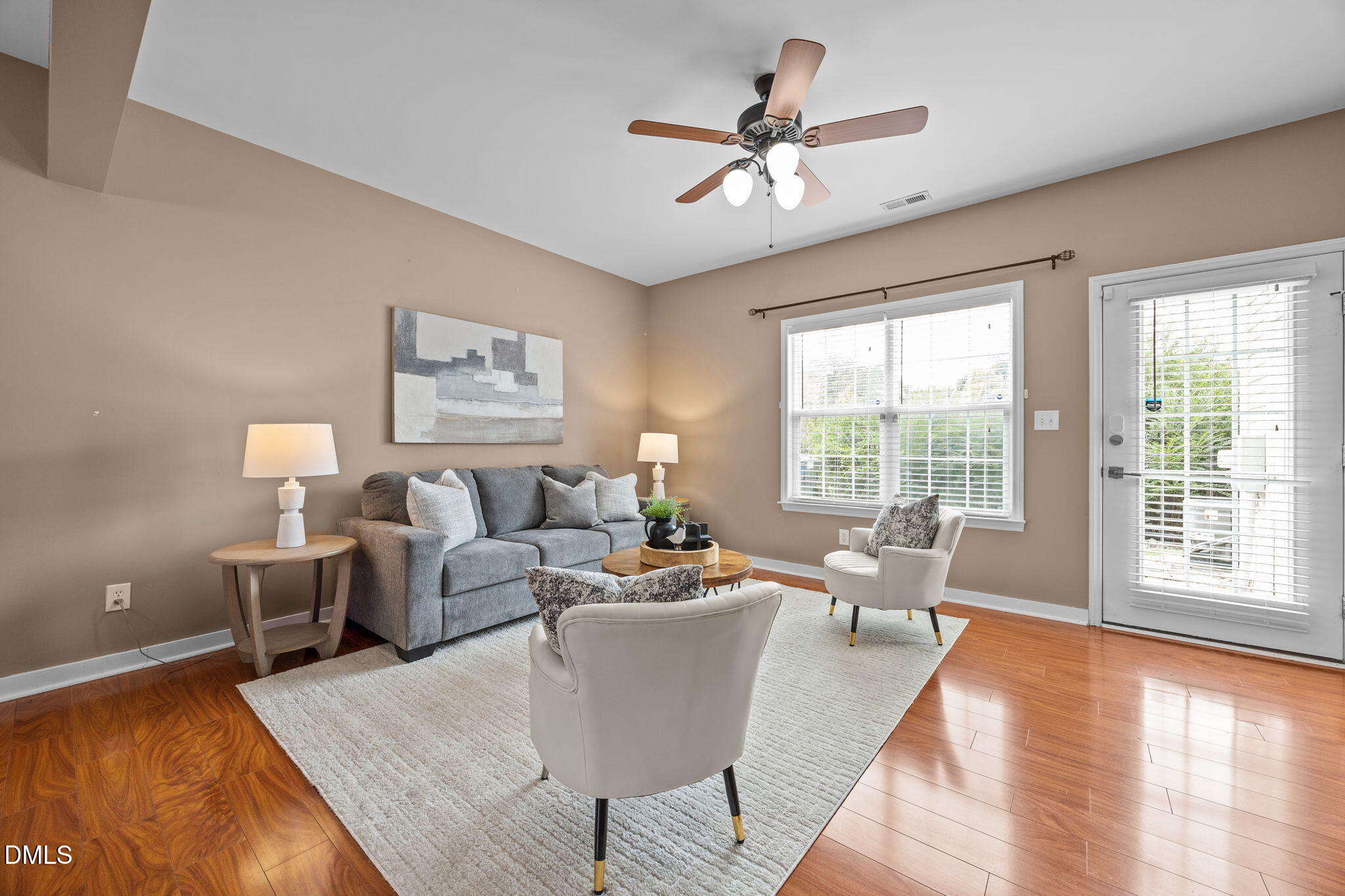 4522 Centrebrook Circle Raleigh, NC 27616 - Photo 2 of 24 a living room with furniture large window and wooden floor