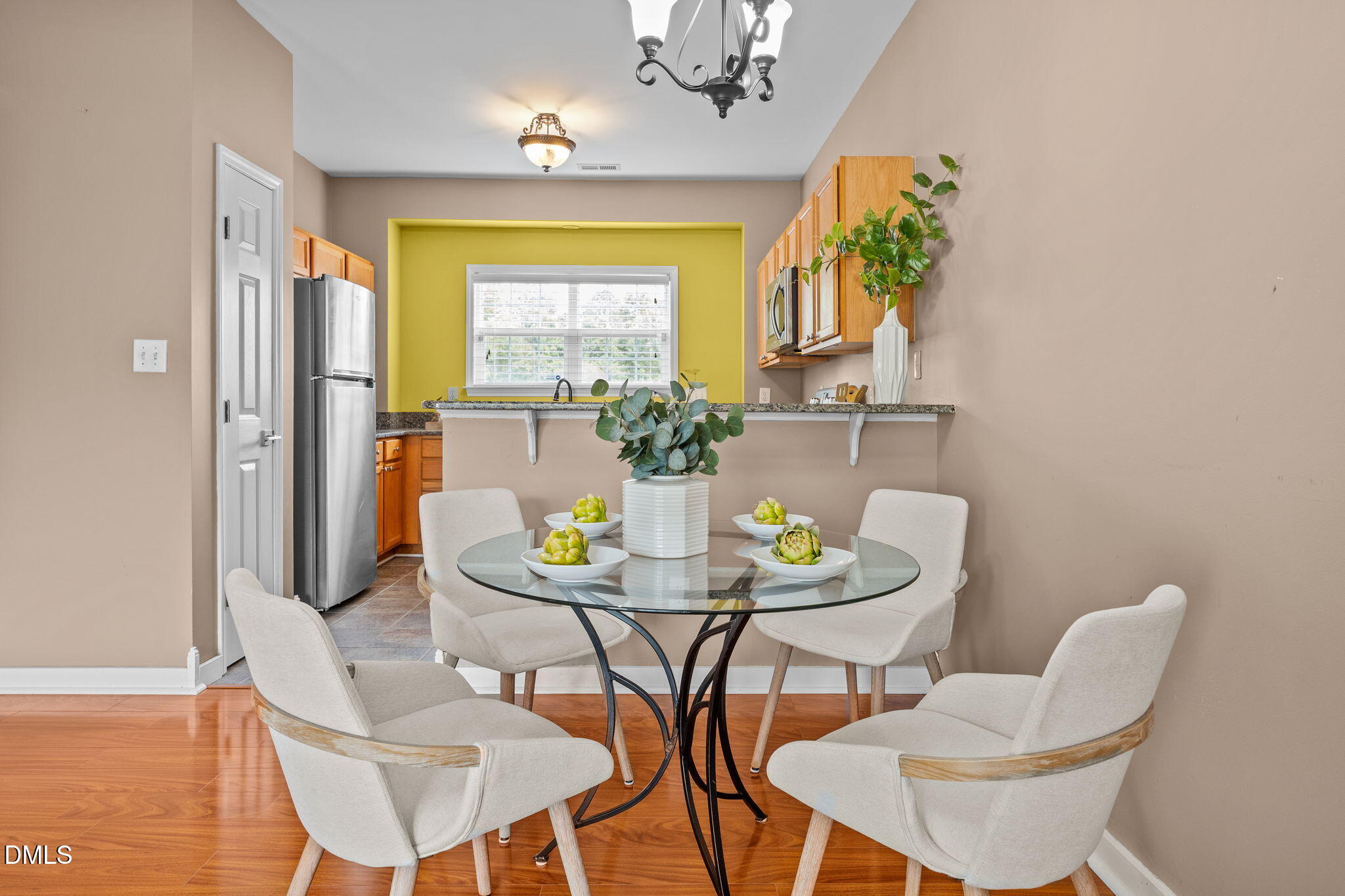 4522 Centrebrook Circle Raleigh, NC 27616 - Photo 4 of 24 a view of a dining room with furniture and chandelier