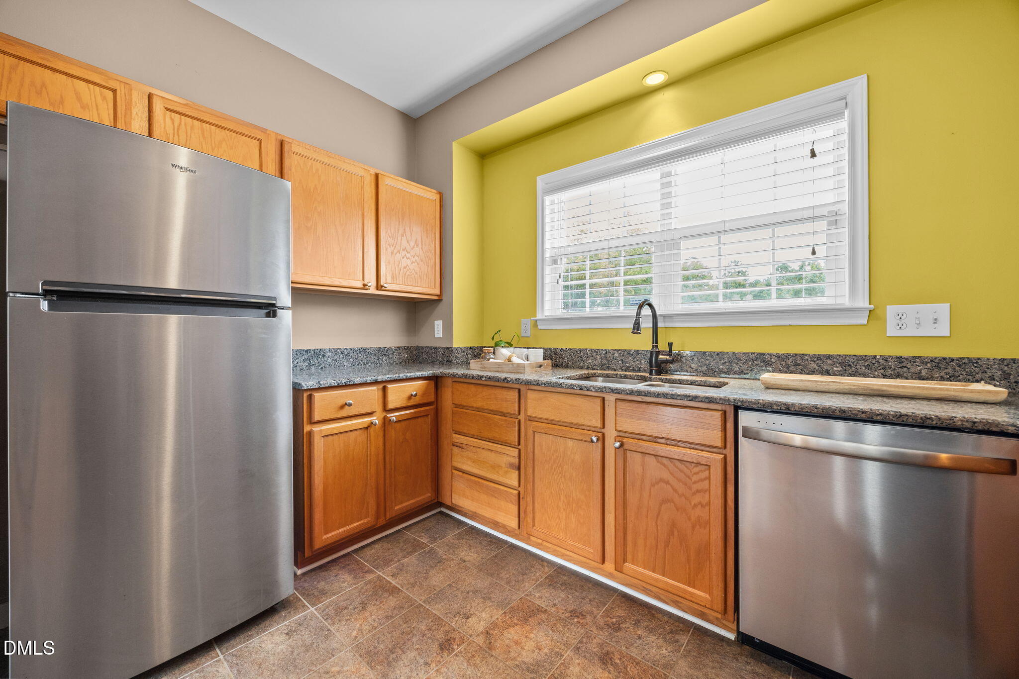 4522 Centrebrook Circle Raleigh, NC 27616 - Photo 7 of 24 a kitchen with stainless steel appliances granite countertop a refrigerator a sink and a stove