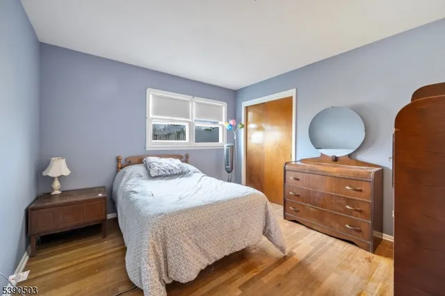 a bedroom with a bed and a desk