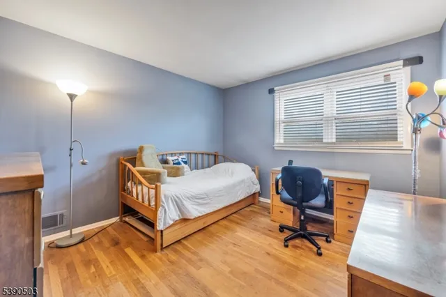 a bedroom with a bed and furniture