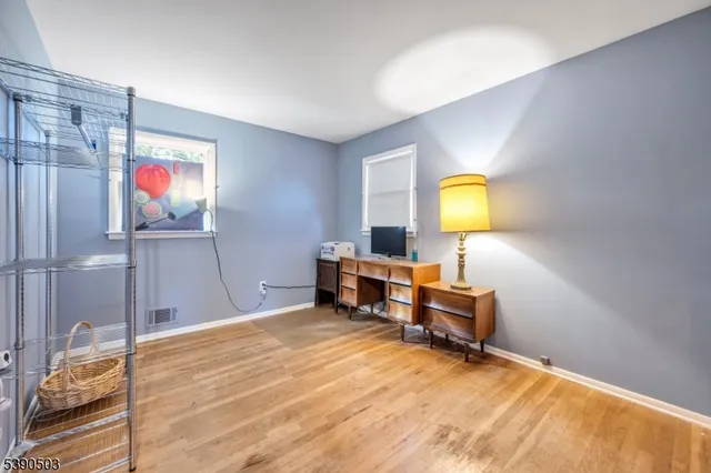 a bathroom with a double vanity sink toilet and a mirror