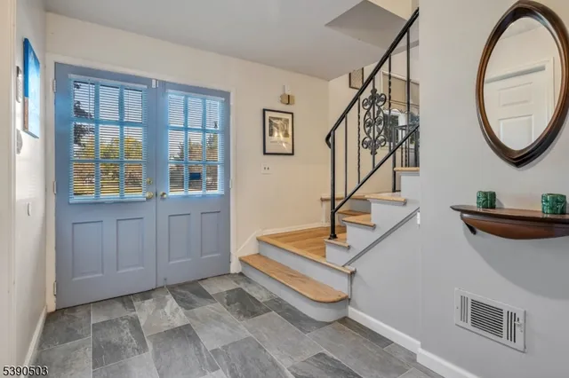 a view of a livingroom with furniture and entryway