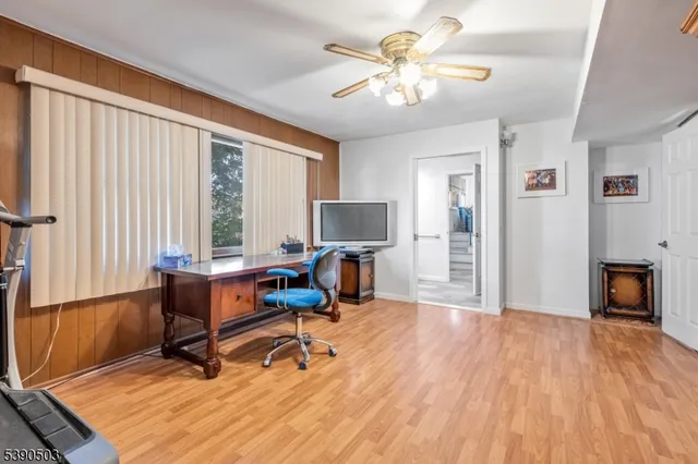 a view of a livingroom with furniture and a flat screen tv