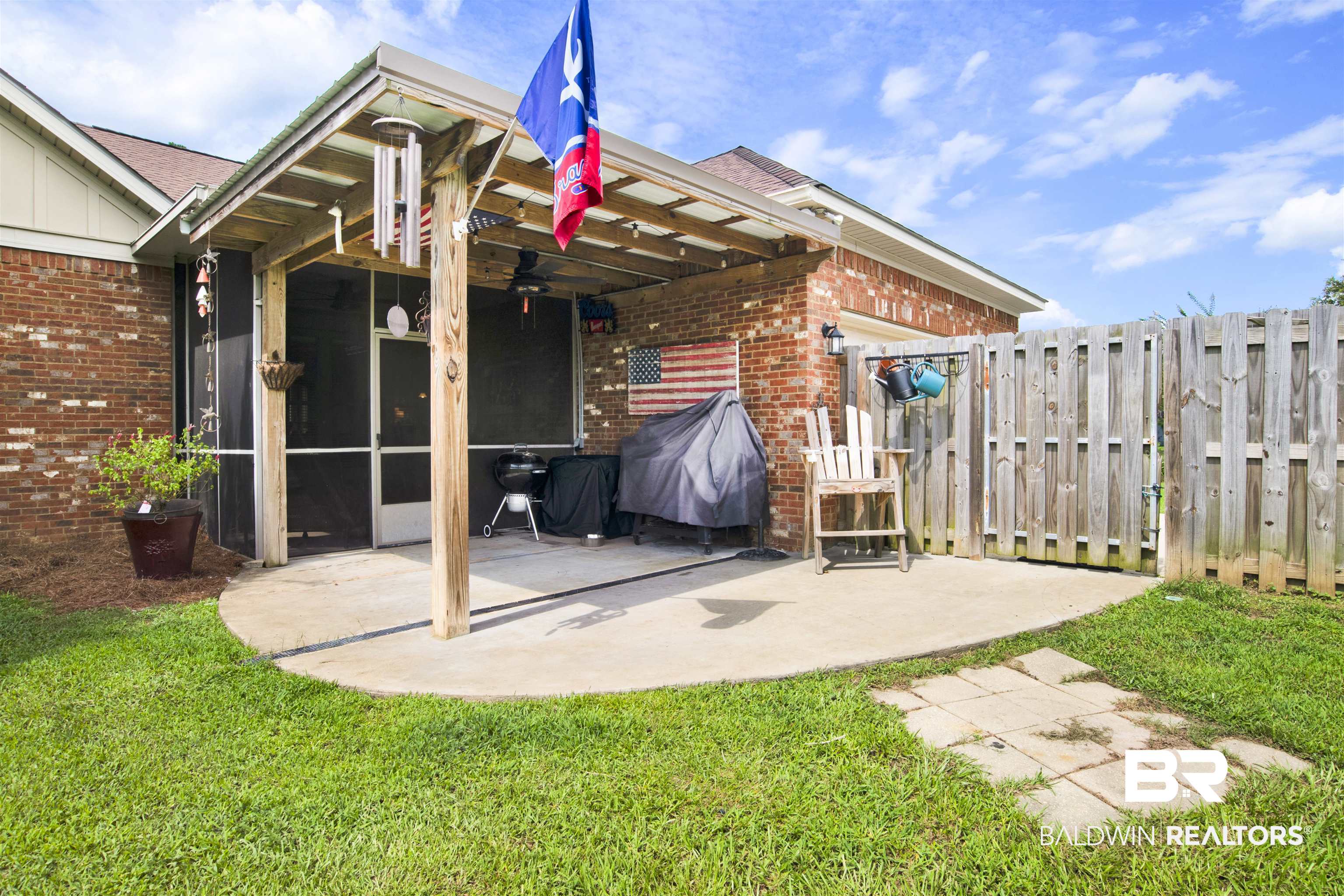10368 Gayfer Rd Extension Fairhope, AL 36532 - Photo 35 of 43 Covered patio featuring a wood-beam structure, concrete flooring, and a ceiling fan