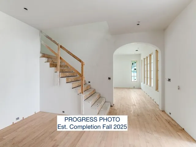 an view of an empty room with a window