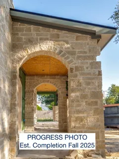 a view of a building with a yard