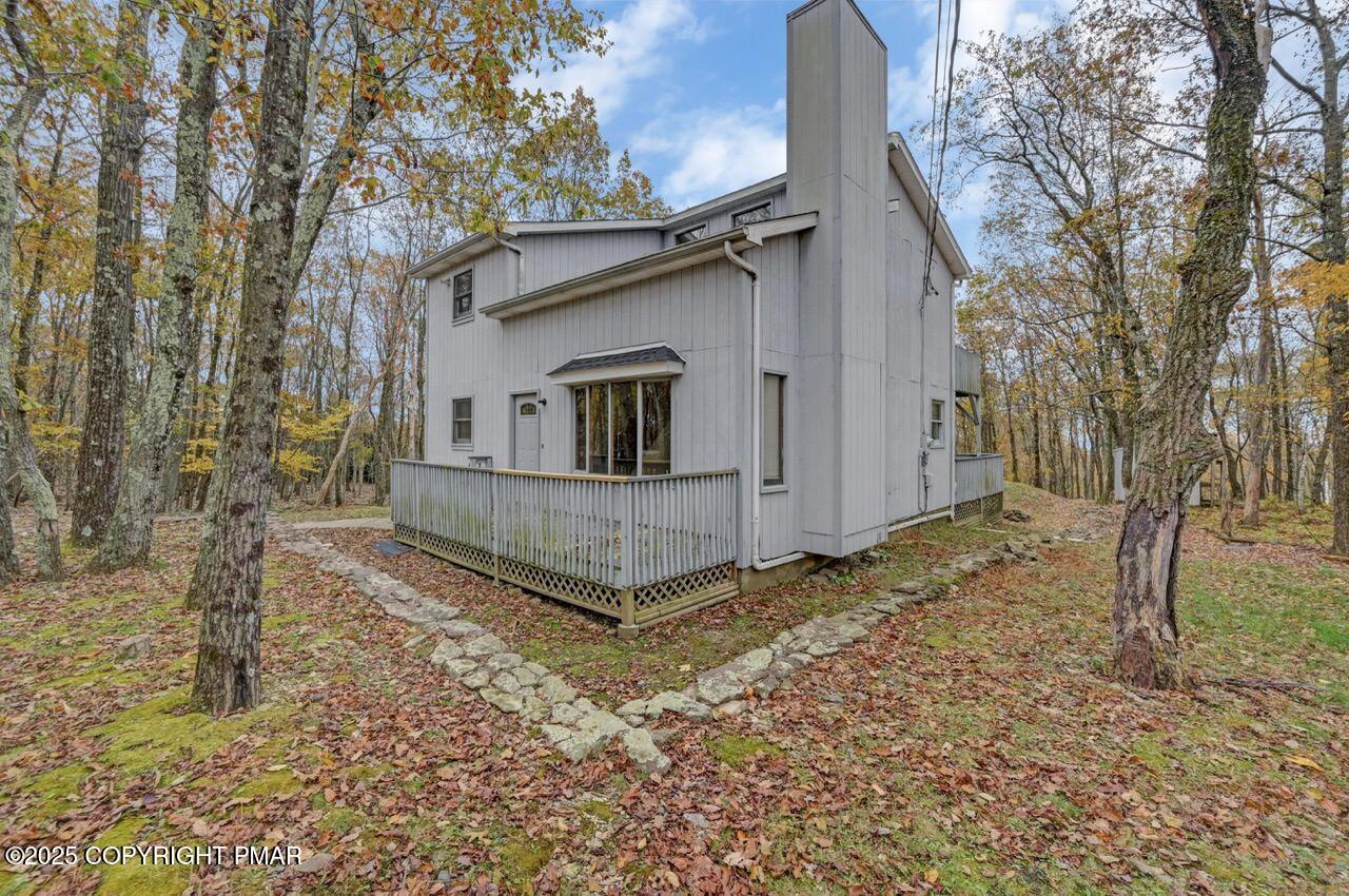 38 Spokane Road Albrightsville, PA 18210 - Photo 2 of 69 a view of a small house with a yard and large tree