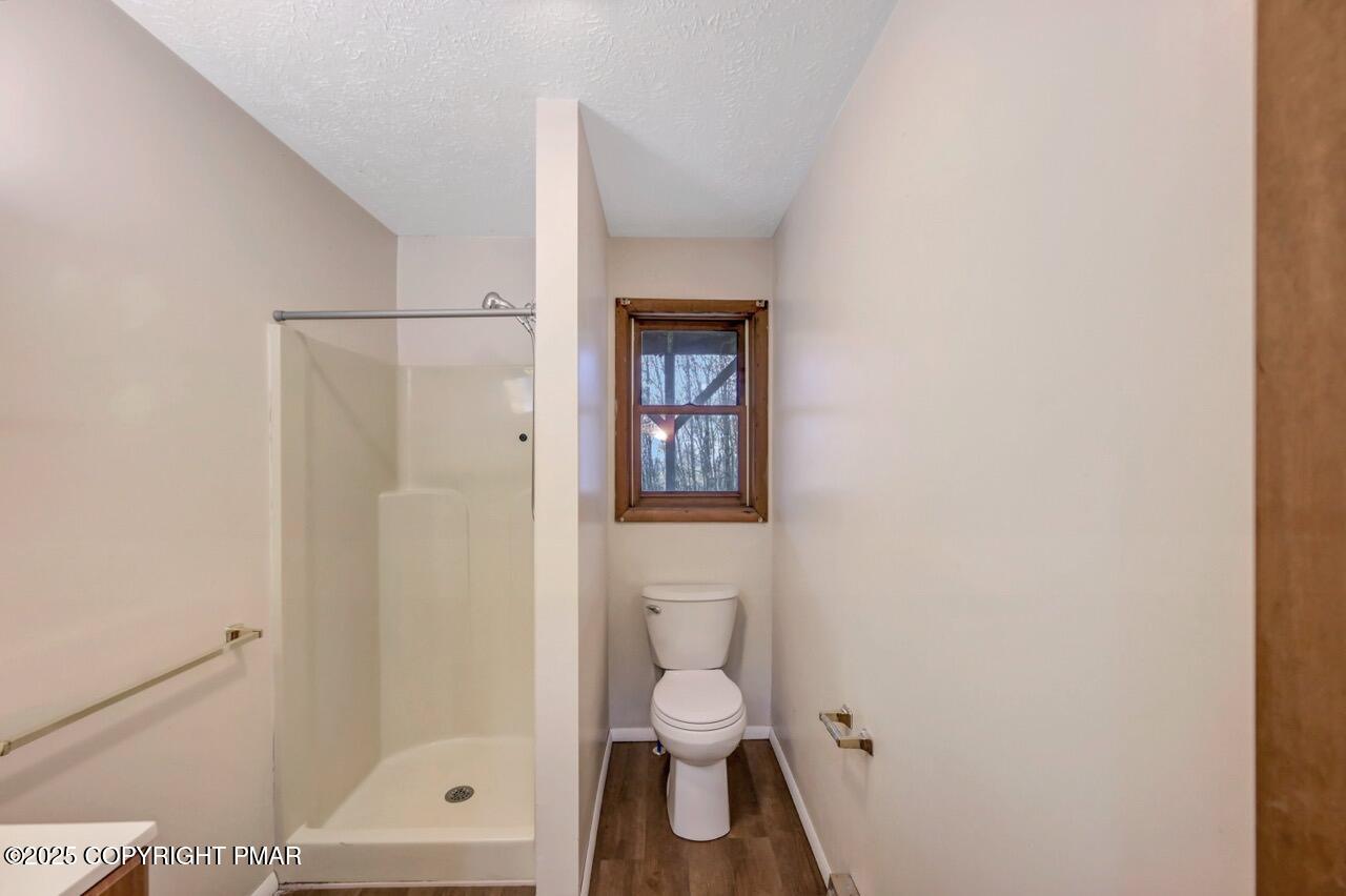 38 Spokane Road Albrightsville, PA 18210 - Photo 32 of 69 a bathroom with a toilet a sink and shower