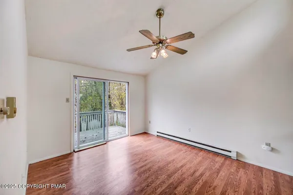 a view of balcony with wooden floor